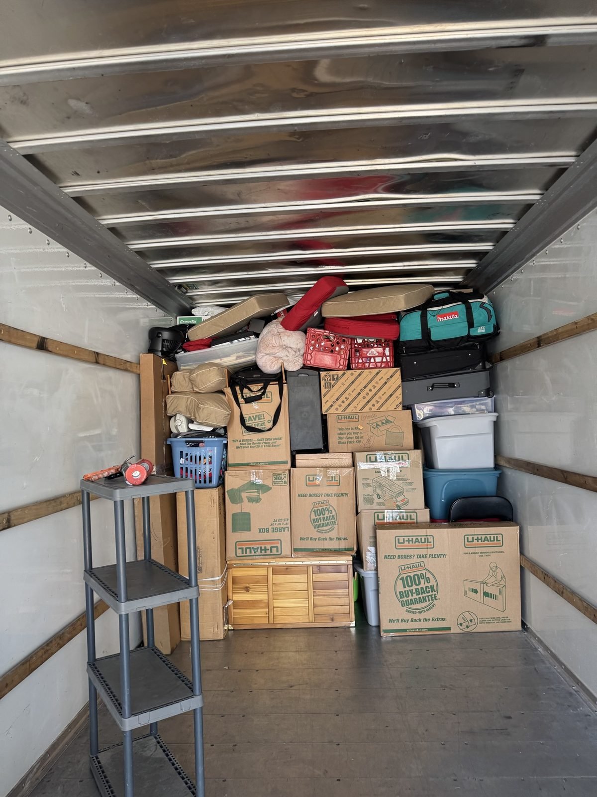 A neatly packed U-Haul truck — boxes stacked tight, no wasted space